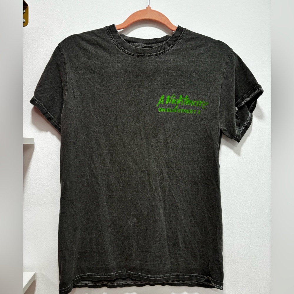 Grey Tahirt w/ Nightmare on Elmstreet 2 logo on front and Freddy Krueger on back